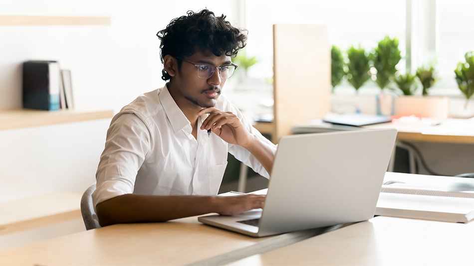 How-does-LASIK-eye-surgery-work-Dr-Aanchal-Gupta-iVision-Laser-Adelaide Man sat la[top wondering "How does LASIK eye surgery work"